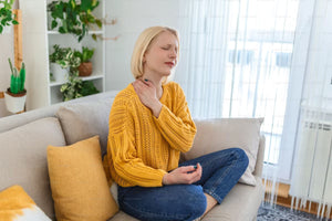 Woman rubbing her neck and shoulder